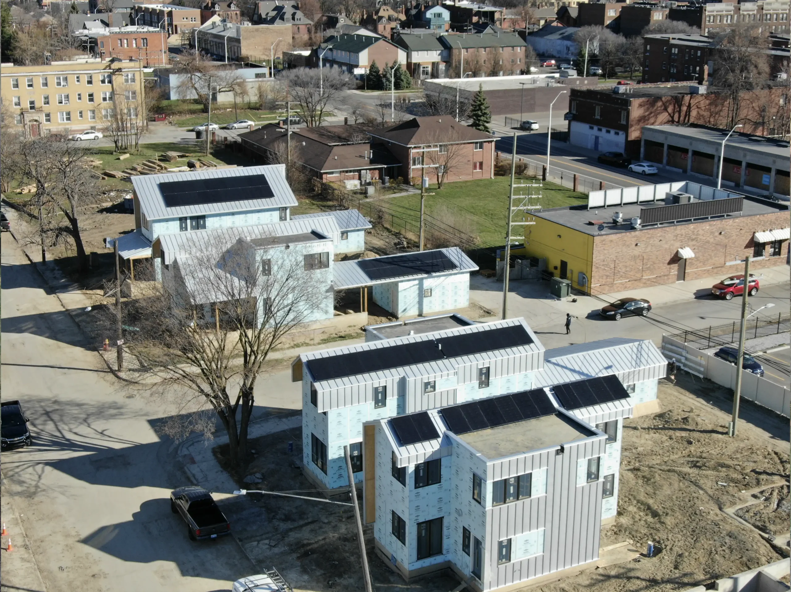 series of solar panels on city buildings scaled